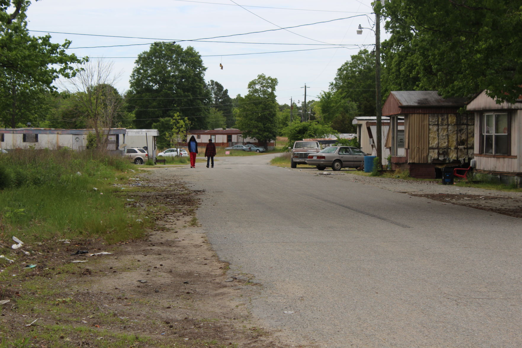 People walking in the trailer park